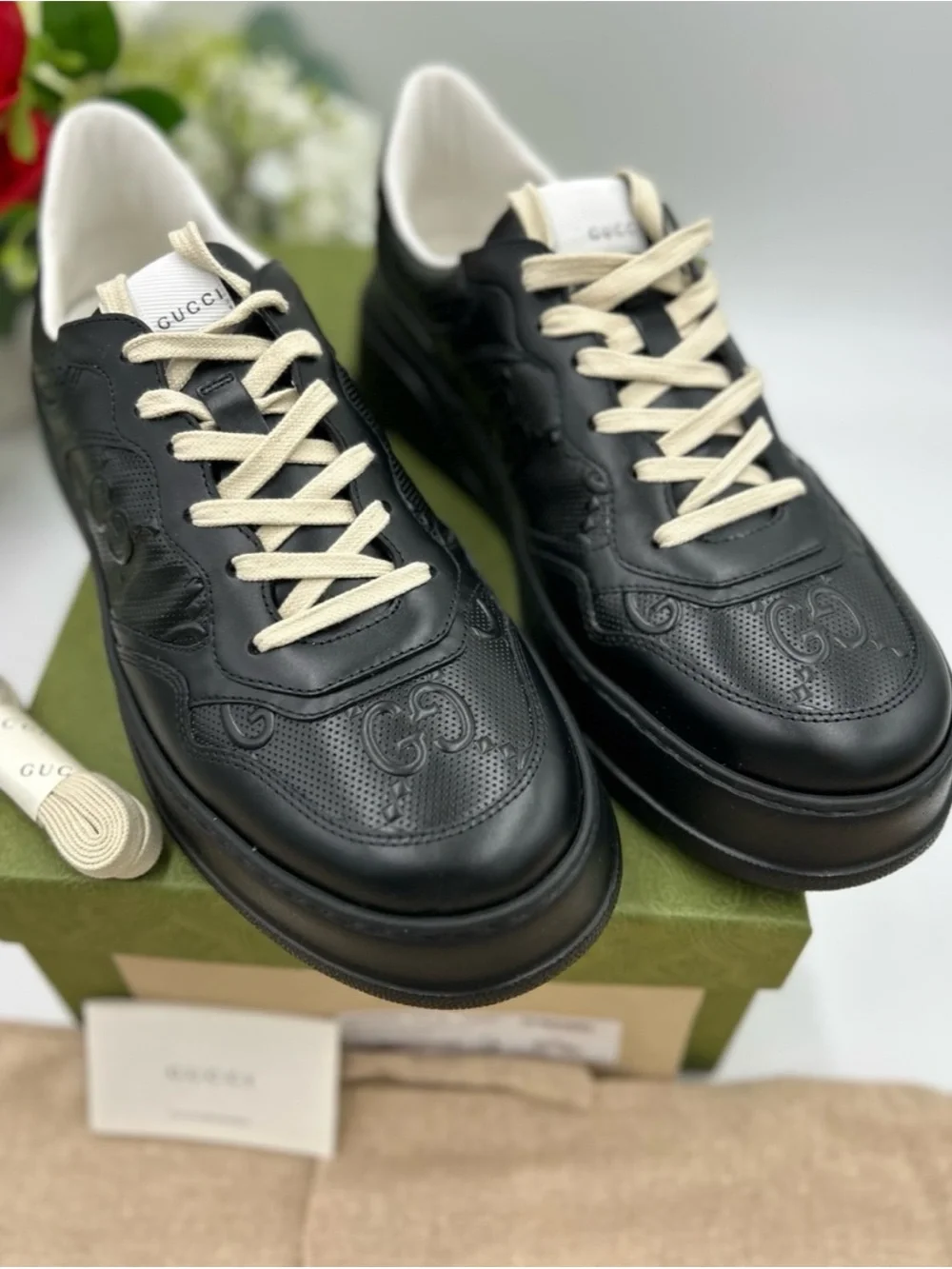 Gucci, GG embossed, black leather sneakers size 9.5 fits 10 made in Italy